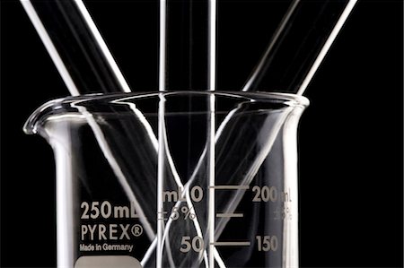 Beaker with test tubes Stock Photo - Premium Royalty-Free, Code: 640-03261581
