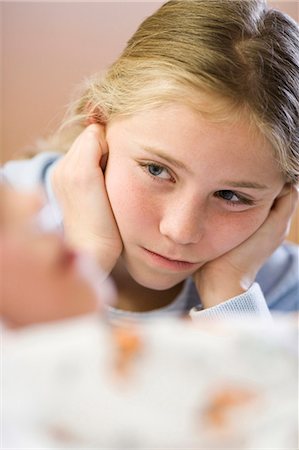 respirer - Young girl sitting by brother in hospital bed Stock Photo - Premium Royalty-Free, Code: 640-03261659