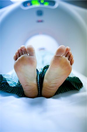 Closeup of woman's feet on diagnostic bed Stock Photo - Premium Royalty-Free, Code: 640-03261722