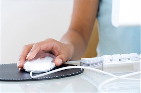 desktop computers - Female hand on mouse with keyboard Stock Photo - Premium Royalty-Free, Code: 640-03261988