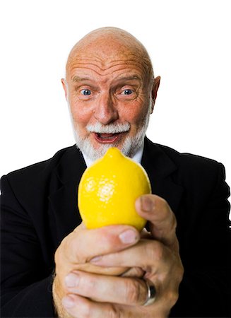 sour - Mature businessman with lemon Stock Photo - Premium Royalty-Free, Code: 640-03262047