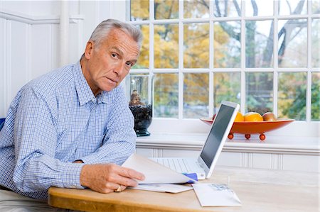 paying bills - Mature man with laptop Stock Photo - Premium Royalty-Free, Code: 640-03262247