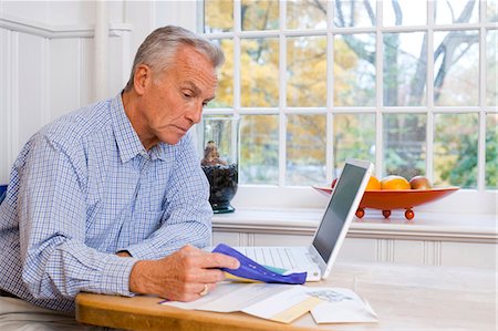 Mature man with laptop Stock Photo - Premium Royalty-Free, Code: 640-03262248