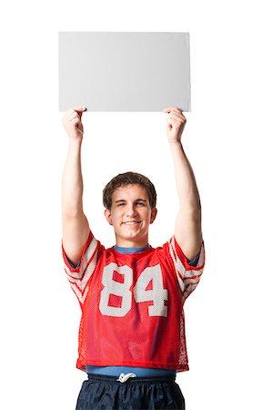 Man in football jersey holding blank sign Foto de stock - Sin royalties Premium, Código: 640-03262298