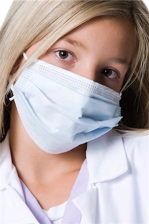 Closeup of girl with surgical mask Stock Photo - Premium Royalty-Free, Code: 640-03262325