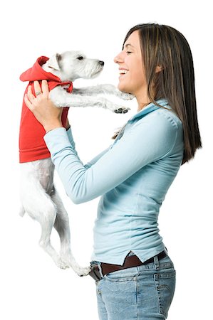 dog person white background - Woman with white dog in hooded sweatshirt Stock Photo - Premium Royalty-Free, Code: 640-03262429