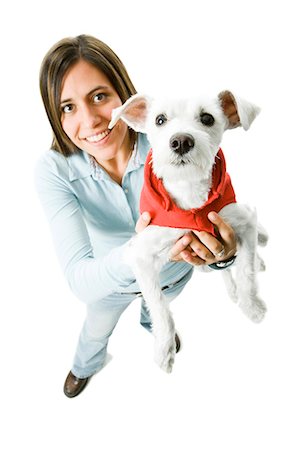 dog person white background - Woman with white dog in hooded sweatshirt Stock Photo - Premium Royalty-Free, Code: 640-03262431