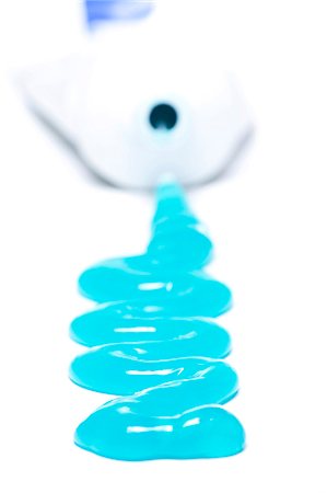 Toothpaste spilling out of tube Stock Photo - Premium Royalty-Free, Code: 640-03262488