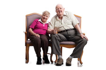elderly couple happy - Elderly couple sitting in armchairs embracing Stock Photo - Premium Royalty-Free, Code: 640-03262550