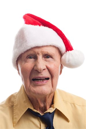 simsearch:640-03263214,k - Mature man in santa hat Stock Photo - Premium Royalty-Free, Code: 640-03262568