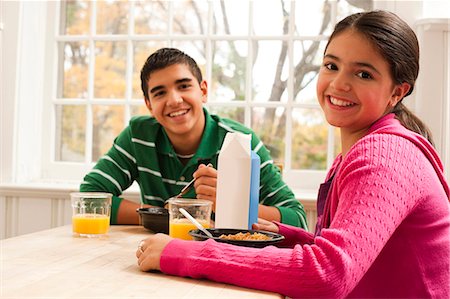 family breakfast kitchen table - Boy and girl eating breakfast Stock Photo - Premium Royalty-Free, Code: 640-03262639