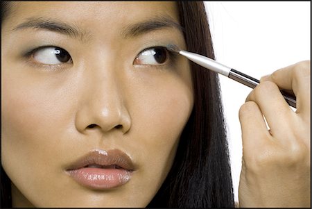 eyeshadow applicator - Woman applying eyeshadow with makeup brush Stock Photo - Premium Royalty-Free, Code: 640-03263055