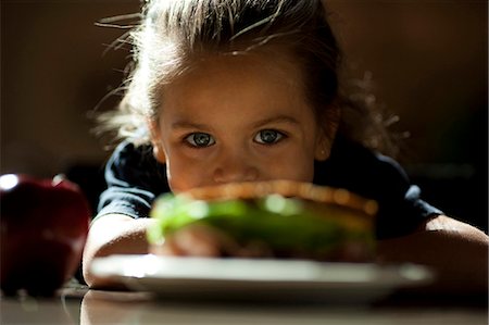 simsearch:640-03260960,k - Young girl looking at sandwich sulking Stock Photo - Premium Royalty-Free, Code: 640-03263096