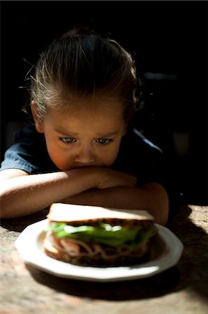 simsearch:640-03260960,k - Young girl looking at sandwich sulking Stock Photo - Premium Royalty-Free, Code: 640-03263098