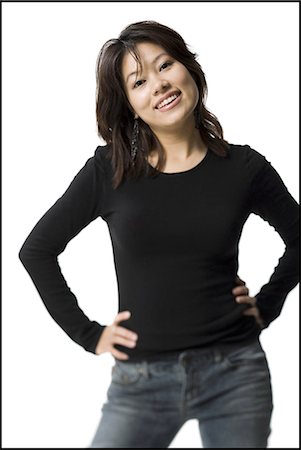 simsearch:640-03263187,k - Woman standing with arms crossed smiling Stock Photo - Premium Royalty-Free, Code: 640-03263113