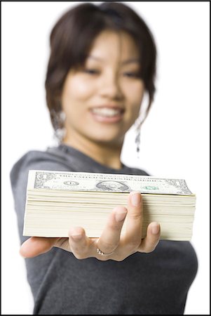 simsearch:640-03260699,k - Woman with stack of US currency smiling Foto de stock - Sin royalties Premium, Código: 640-03263126