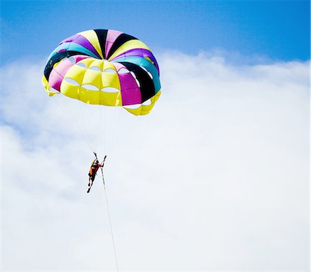 parachuting - Man with parachute floating Stock Photo - Premium Royalty-Free, Code: 640-03263198