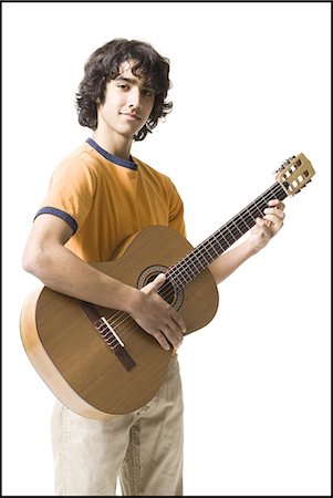 Boy playing the guitar Foto de stock - Sin royalties Premium, Código: 640-03263388