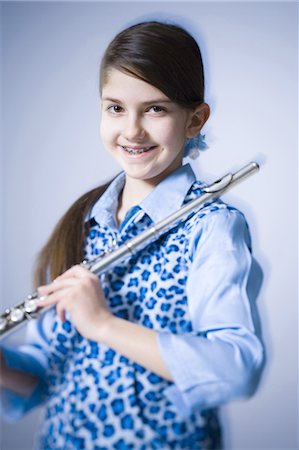 Girl playing the flute Foto de stock - Sin royalties Premium, Código: 640-03263415