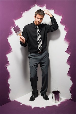 Man standing in the corner Stock Photo - Premium Royalty-Free, Code: 640-03263657