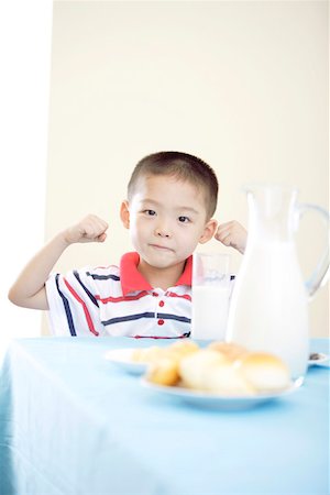 simsearch:642-01732852,k - Boy sitting at breakfast, smiling portrait Stock Photo - Premium Royalty-Free, Code: 642-01734142