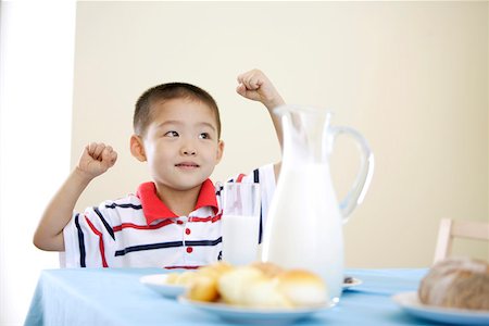 fist on table - Boy sitting at breakfast table Stock Photo - Premium Royalty-Free, Code: 642-01734256