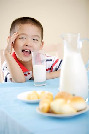 simsearch:642-01732852,k - Boy sitting at breakfast table Stock Photo - Premium Royalty-Free, Code: 642-01734259