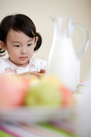 simsearch:642-01734328,k - Girl sitting at breakfast table Stock Photo - Premium Royalty-Free, Code: 642-01734252