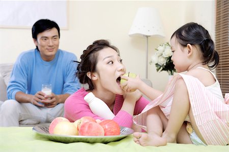 Family sharing milk and fruit at home Stock Photo - Premium Royalty-Free, Code: 642-01734310