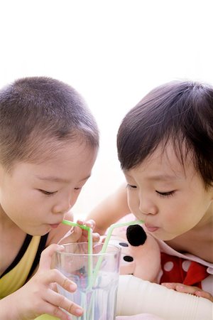 simsearch:642-01734328,k - Close-up of a boy and girl drinking milk Stock Photo - Premium Royalty-Free, Code: 642-01734337