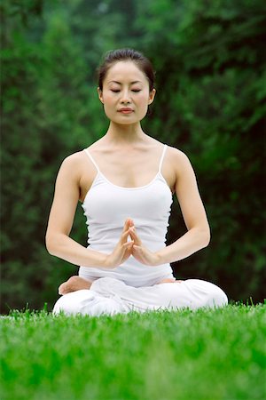 Young woman doing yoga Stock Photo - Premium Royalty-Free, Code: 642-01734624