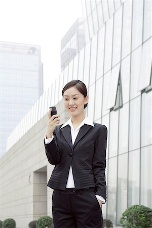 simsearch:642-01734897,k - Businesswoman using mobile phone Stock Photo - Premium Royalty-Free, Code: 642-01734791