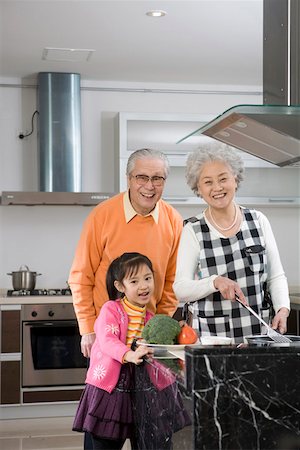simsearch:6113-09199924,k - Family in kitchen, smiling, portrait Stock Photo - Premium Royalty-Free, Code: 642-01735156