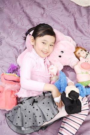 simsearch:642-01736683,k - Girl playing with dolls in bed Stock Photo - Premium Royalty-Free, Code: 642-01735287