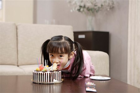 east asian ethnicity girl cake - Portrait of a girl eating cake Stock Photo - Premium Royalty-Free, Code: 642-01735345