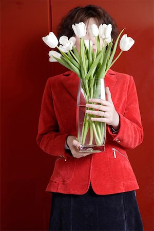 Woman holding bouquet of tulips Stock Photo - Premium Royalty-Free, Code: 642-01735431