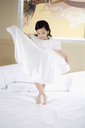 simsearch:642-01734328,k - Girl standing on bed Stock Photo - Premium Royalty-Free, Code: 642-01735573