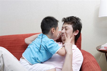simsearch:642-01732852,k - Father playing with son on sofa Stock Photo - Premium Royalty-Free, Code: 642-01735595