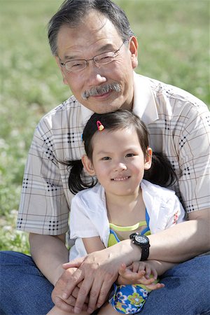 simsearch:642-01735677,k - Girl sitting with grandfather on field Stock Photo - Premium Royalty-Free, Code: 642-01735672