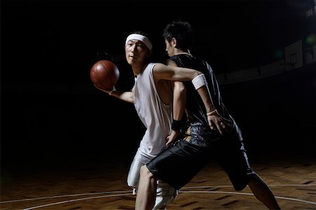 Basketball players playing one on one Stock Photo - Premium Royalty-Free, Code: 642-01735944