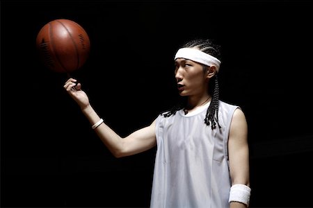 simsearch:642-01735997,k - Basketball player spinning basketball on fingertip Stock Photo - Premium Royalty-Free, Code: 642-01735950