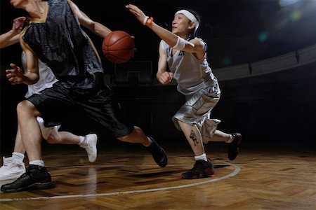 dark people running - Three men playing basketball Stock Photo - Premium Royalty-Free, Code: 642-01735994