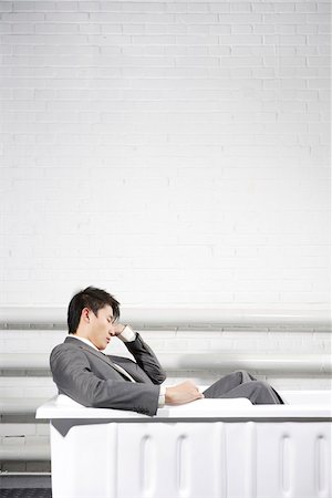 funny pictures of people sleeping - Office young man sitting in a bathtub, sleeping Stock Photo - Premium Royalty-Free, Code: 642-01736374