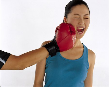 Man punching woman Stock Photo - Premium Royalty-Free, Code: 642-01736540