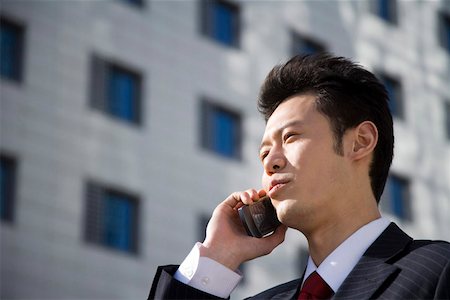 simsearch:642-01734897,k - Mid adult man using mobile phone, low angle view Stock Photo - Premium Royalty-Free, Code: 642-01736600