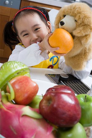 simsearch:642-01736683,k - Girl feeding orange to doll Stock Photo - Premium Royalty-Free, Code: 642-01736654