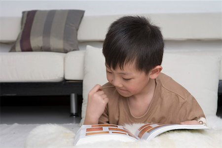simsearch:642-01732852,k - Boy reading book, close-up Stock Photo - Premium Royalty-Free, Code: 642-01736822