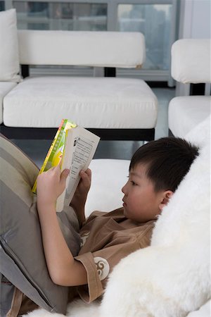 simsearch:642-01732852,k - Boy reading book, side view Stock Photo - Premium Royalty-Free, Code: 642-01736823