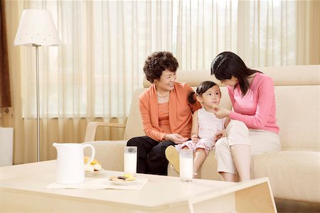 family lamp home - Grandmother, Mother and daughter sitting in sofa at home Stock Photo - Premium Royalty-Free, Code: 642-01736945