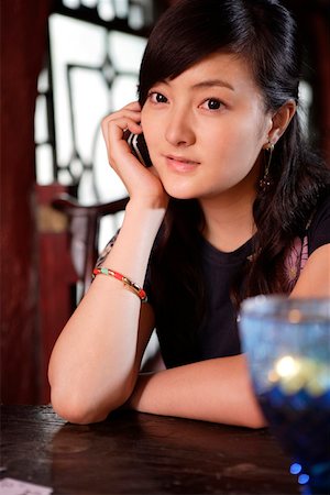 simsearch:642-01734897,k - Young woman using mobile phone Stock Photo - Premium Royalty-Free, Code: 642-01737003